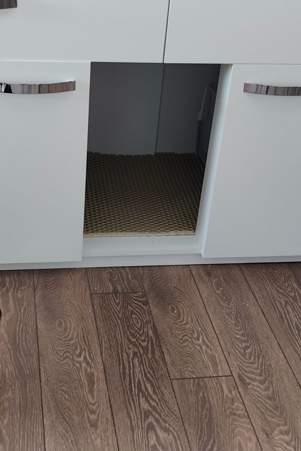 Opening for cats to enter the enclosed drawer